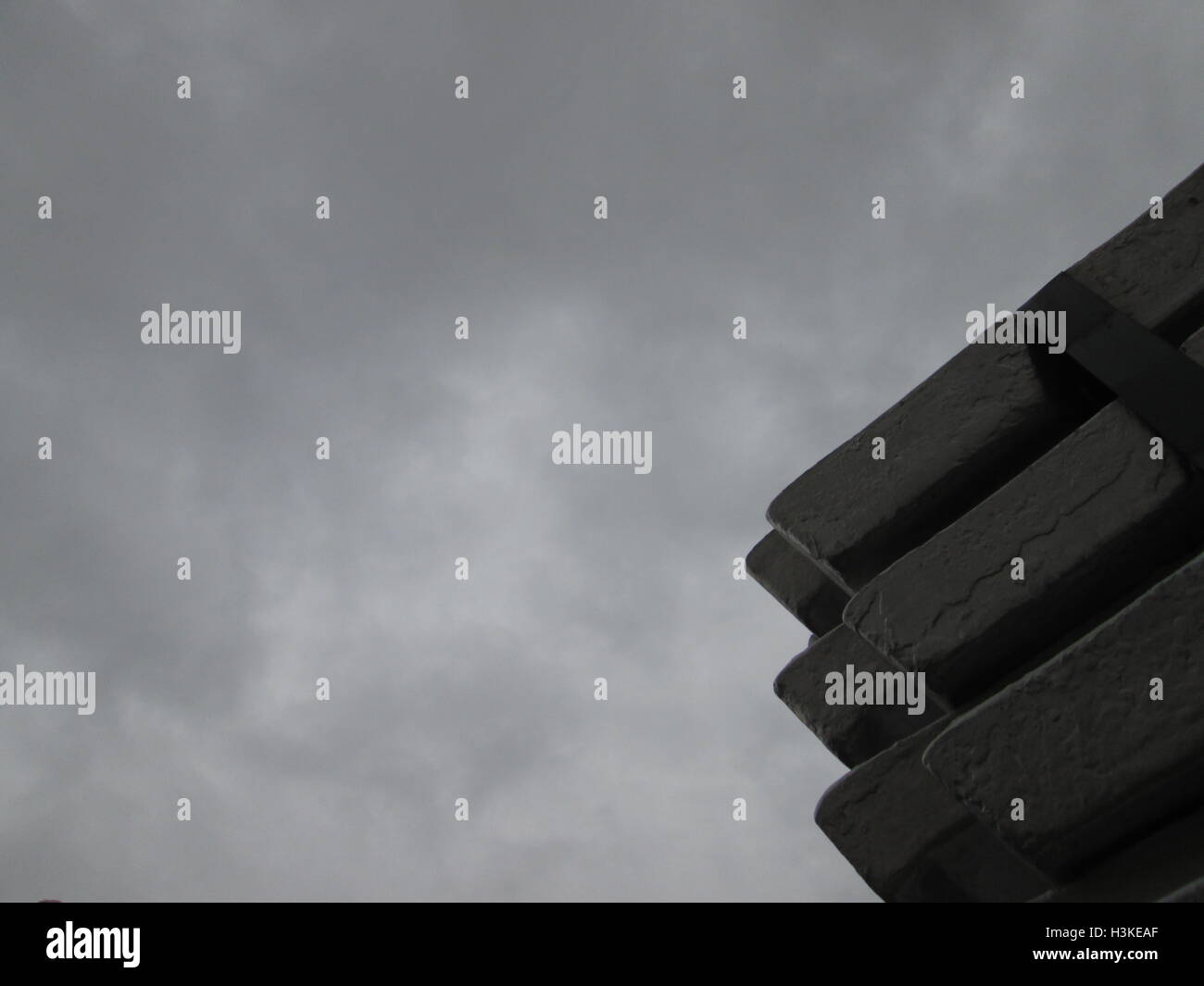 Puerto Ordaz, Venezuela, 10 October 2016.  Weather in Venezuela. Fully it dawned cloudy day in the city this South American country. This image shows a stack of several aluminum ingots produced in an aluminum reduction plant, these companies are mostly in this area of the country, on the photo completely gray sky in the background can be seen. Jorgeprz / Alamy Live News. Stock Photo