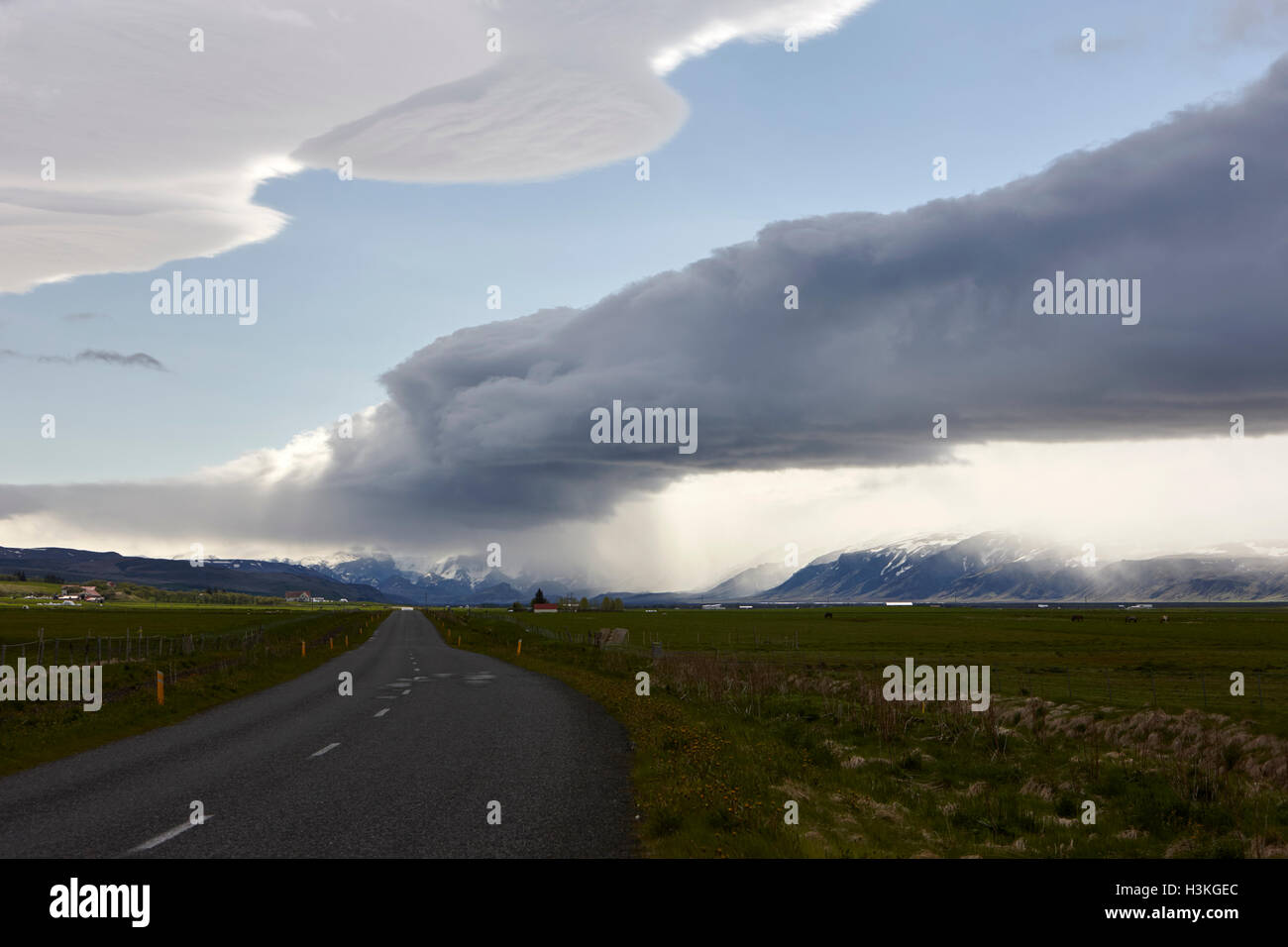road into the thorsmork mountains and cloud storm front formation over Hlidarendi Hvolsvollur Iceland Stock Photo