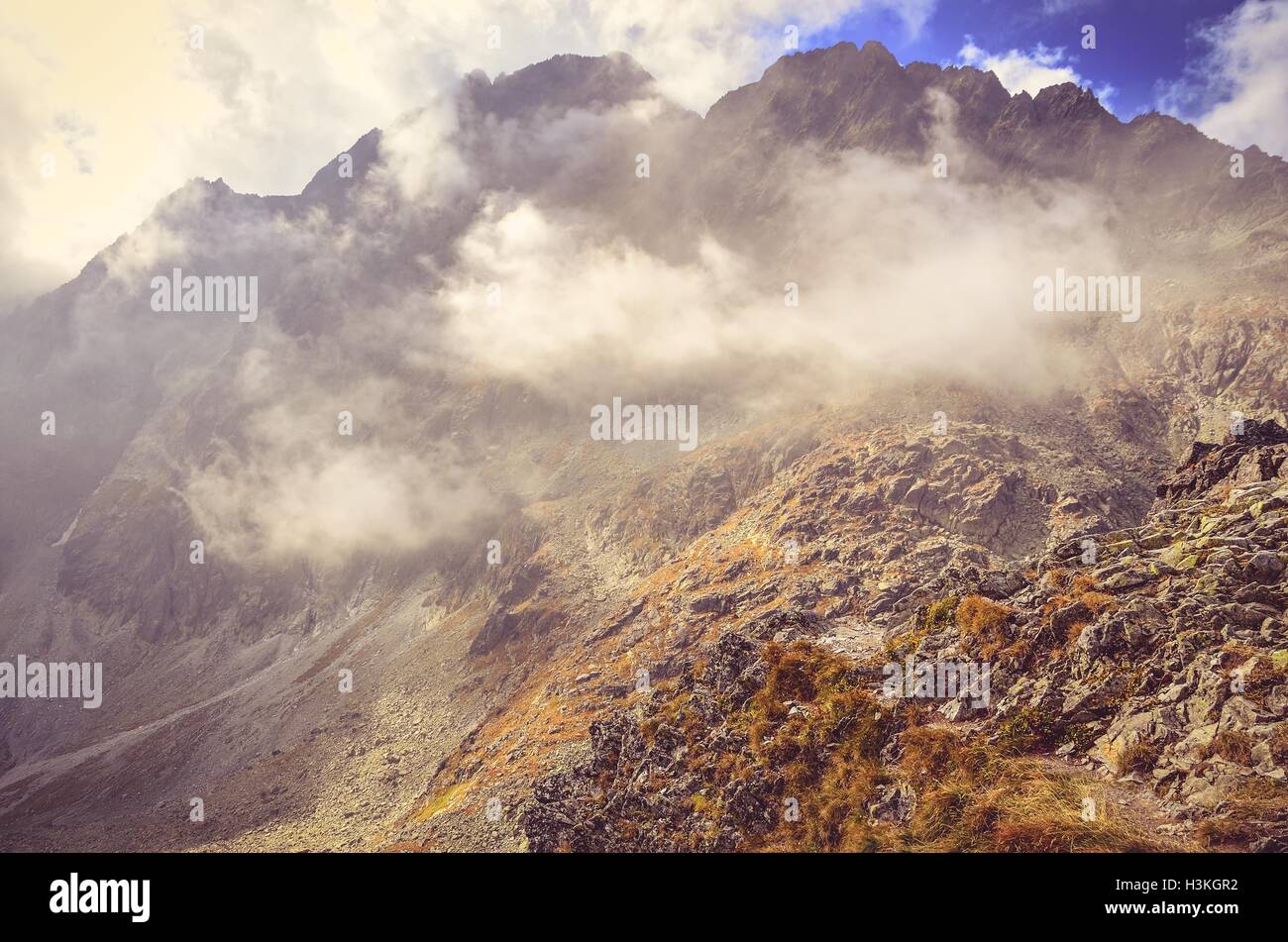 Summer mountain landscape. Rocky peaks in the clouds in High Tatra, Slovakia. Stock Photo