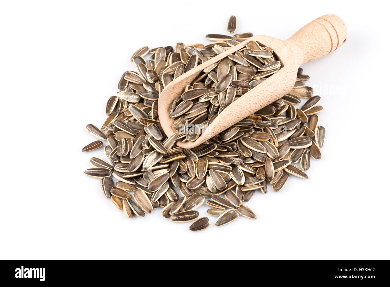 sunflower seeds pile isolated on white background Stock Photo - Alamy