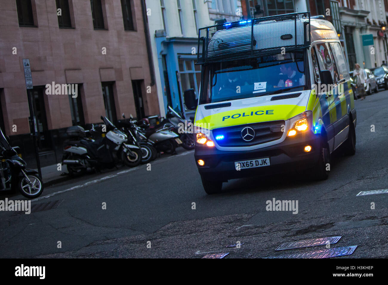 London Metropolitan Police Van Responding to an Emergency with Blue lights flashing Stock Photo