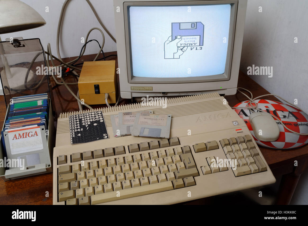 Amiga 500, Commodore 1084S monitor and diskettes on the table Stock Photo
