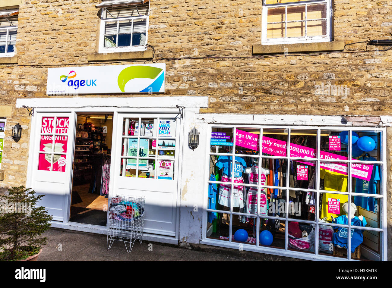 Age uk shop front sign store entrance charity shop shops GB UK Stock