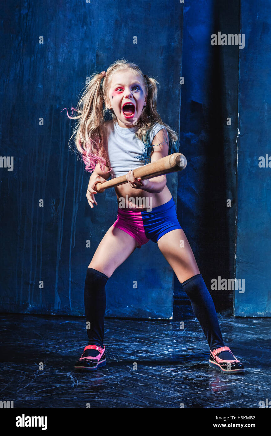 Halloween theme Girl with baseball bat ready to hit Stock Photo Alamy
