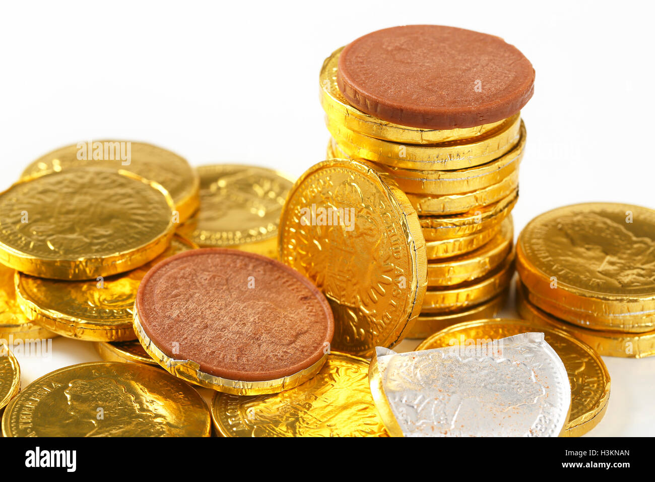 close up of golden chocolate coins stack Stock Photo