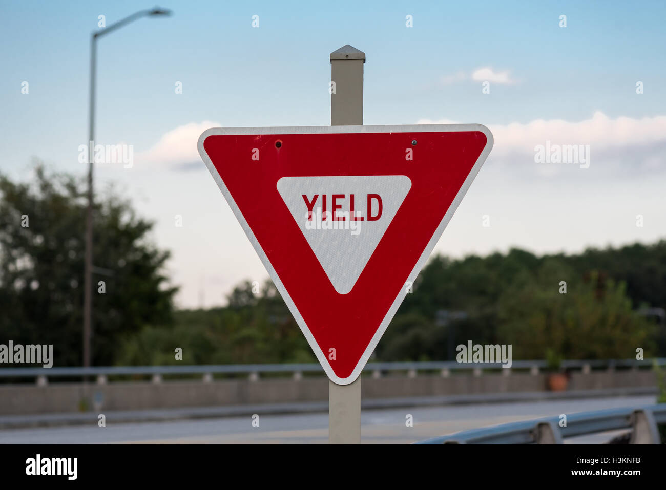 Yield Sign On Bridge In Red Instead Of Yellow Stock Photo Alamy