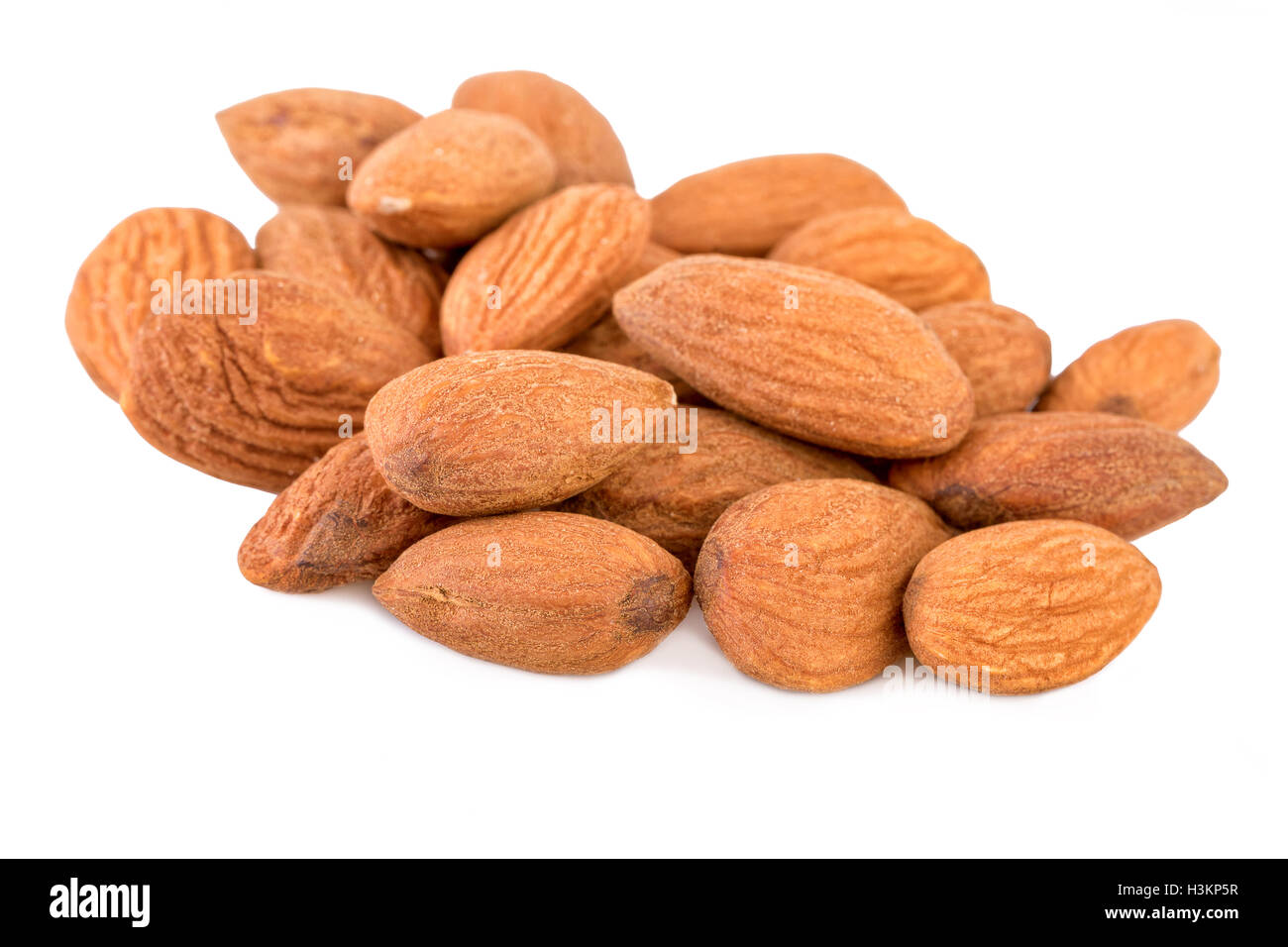 Heap of Almond Nuts on White Stock Photo