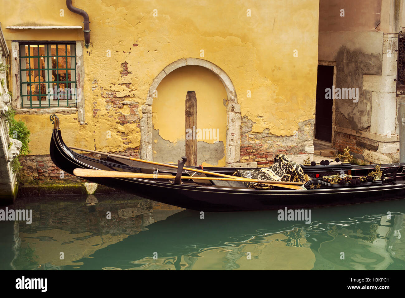 empty gondola in city water channel in Venice, Italy Stock Photo