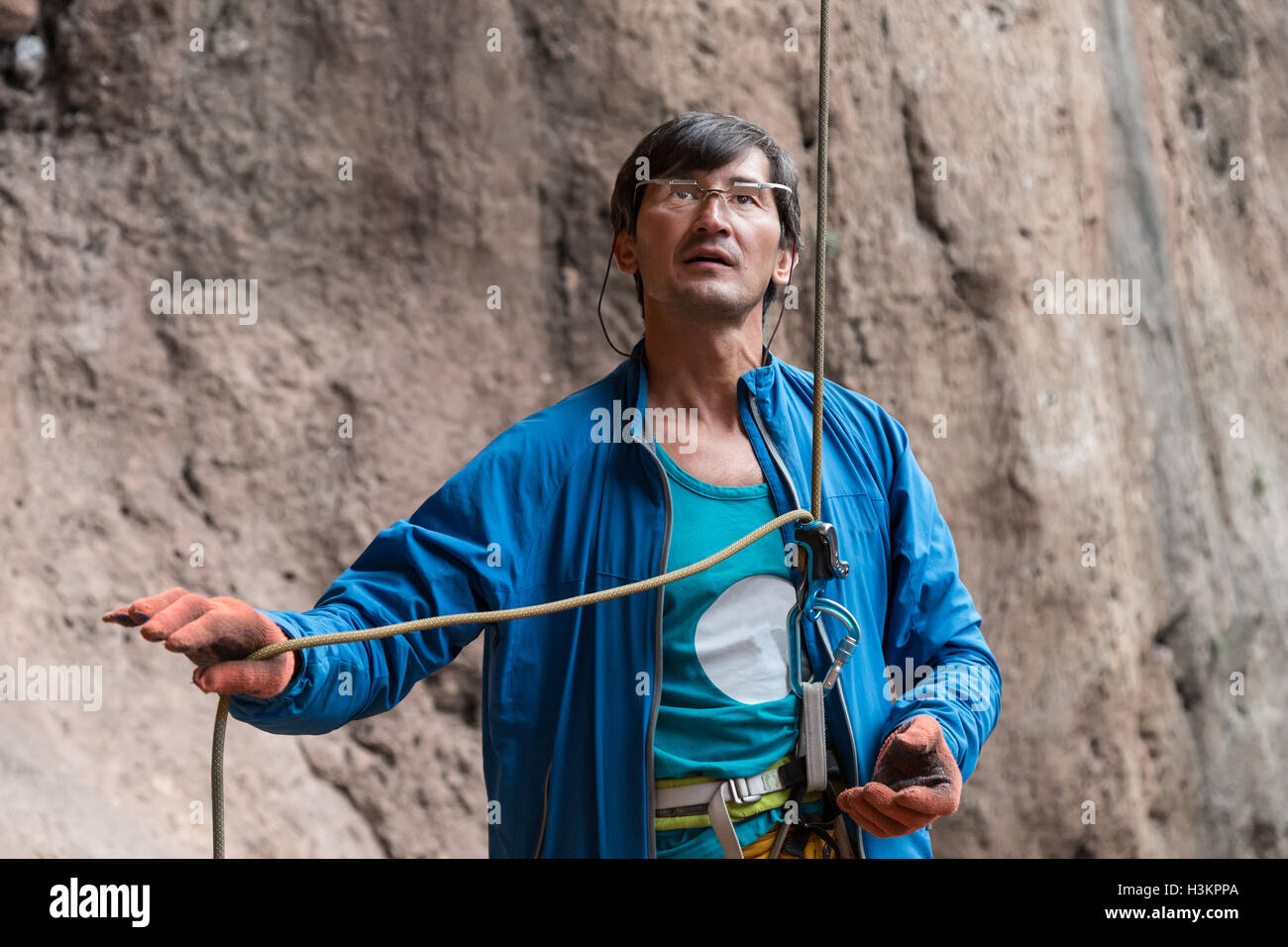 Athlete belays Climber using belaying device and rope Stock Photo Alamy