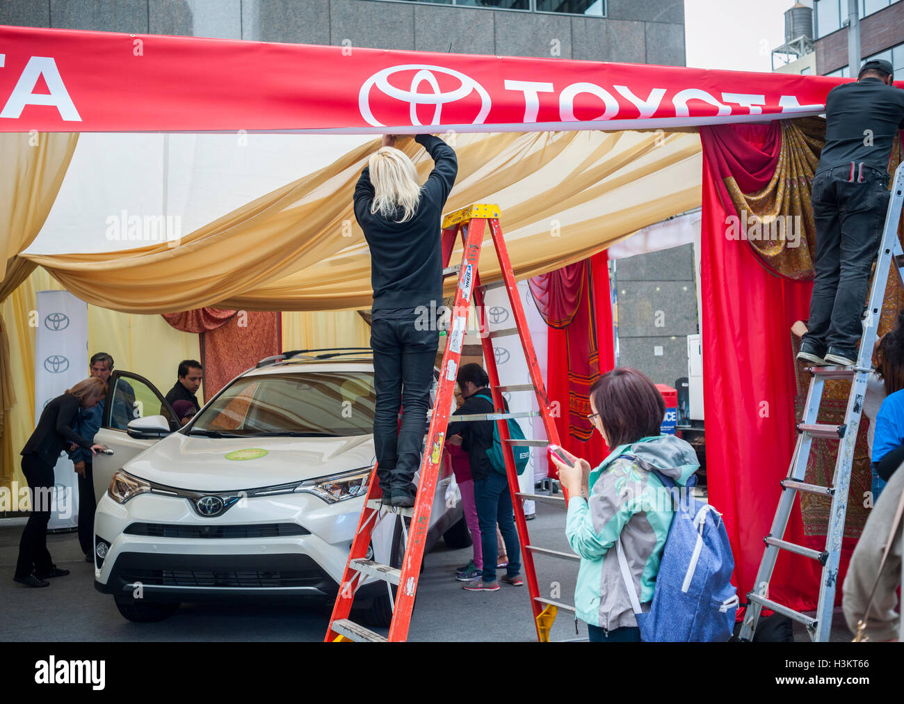 A Toyota promotional event at a street fair in New York on Sunday, October 2, 2016. New vehicle sales are reported to have fallen to $47 billion in September, 0.3% less than the same time last year.  (© Richard B. Levine) Stock Photo