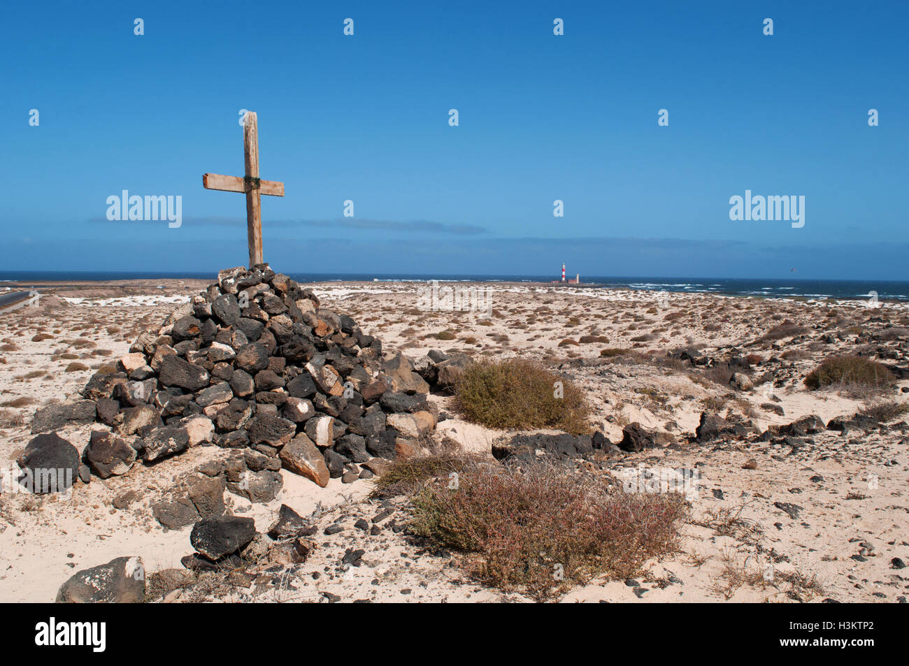 Fuerteventura, Canary Islands, North Africa, Spain: a cross on a stack of rocks on the road to the El Toston Lighthouse, in the northwest of the island Stock Photo