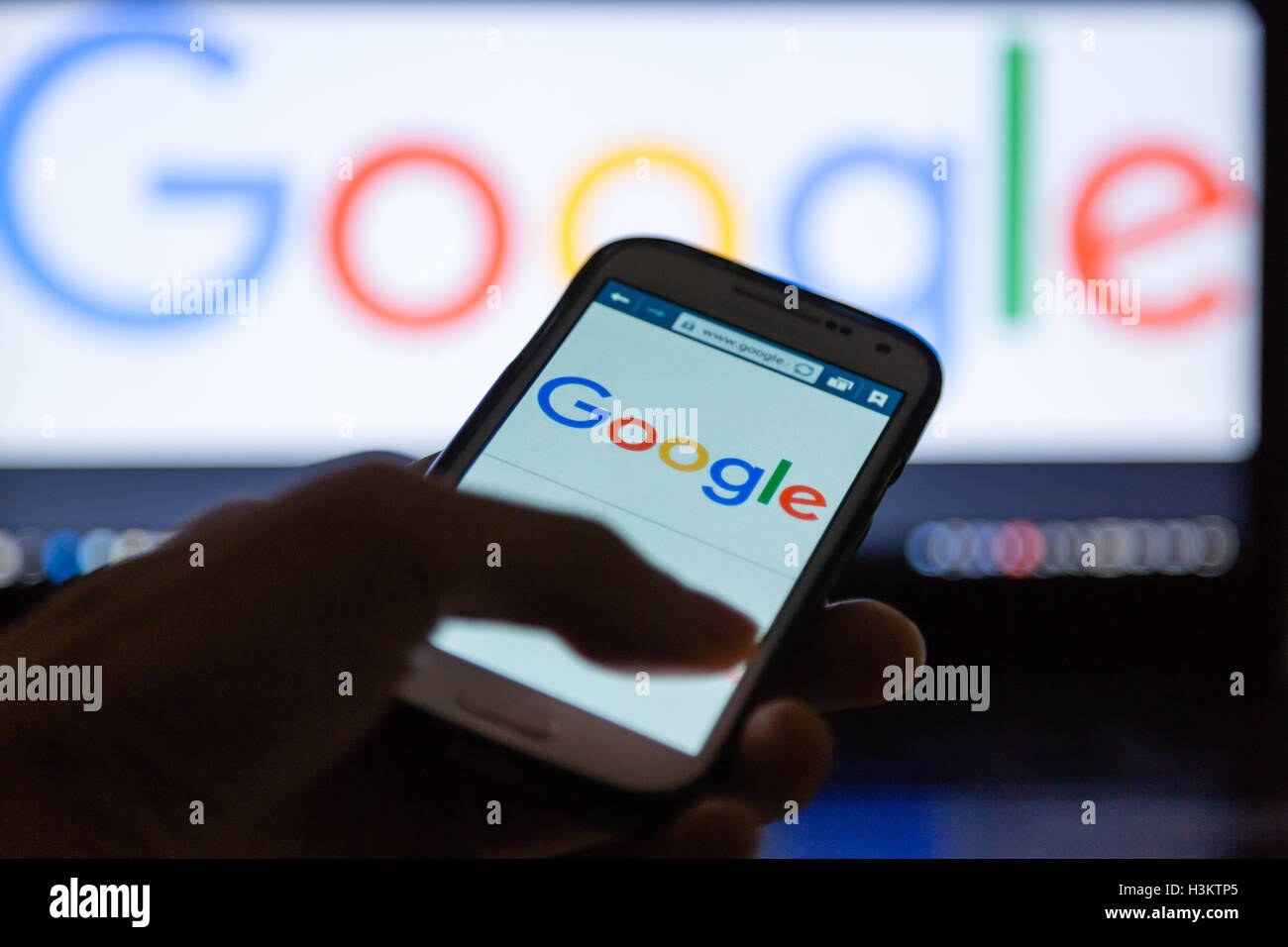 A smartphone display shows Google homepage Stock Photo - Alamy
