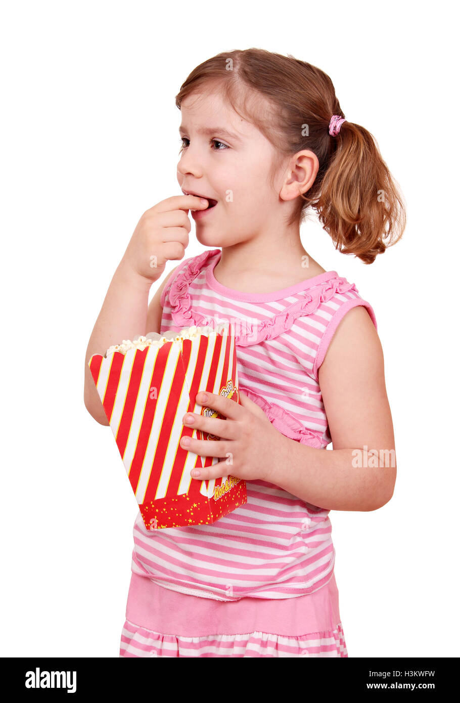hungry little girl eat popcorn Stock Photo