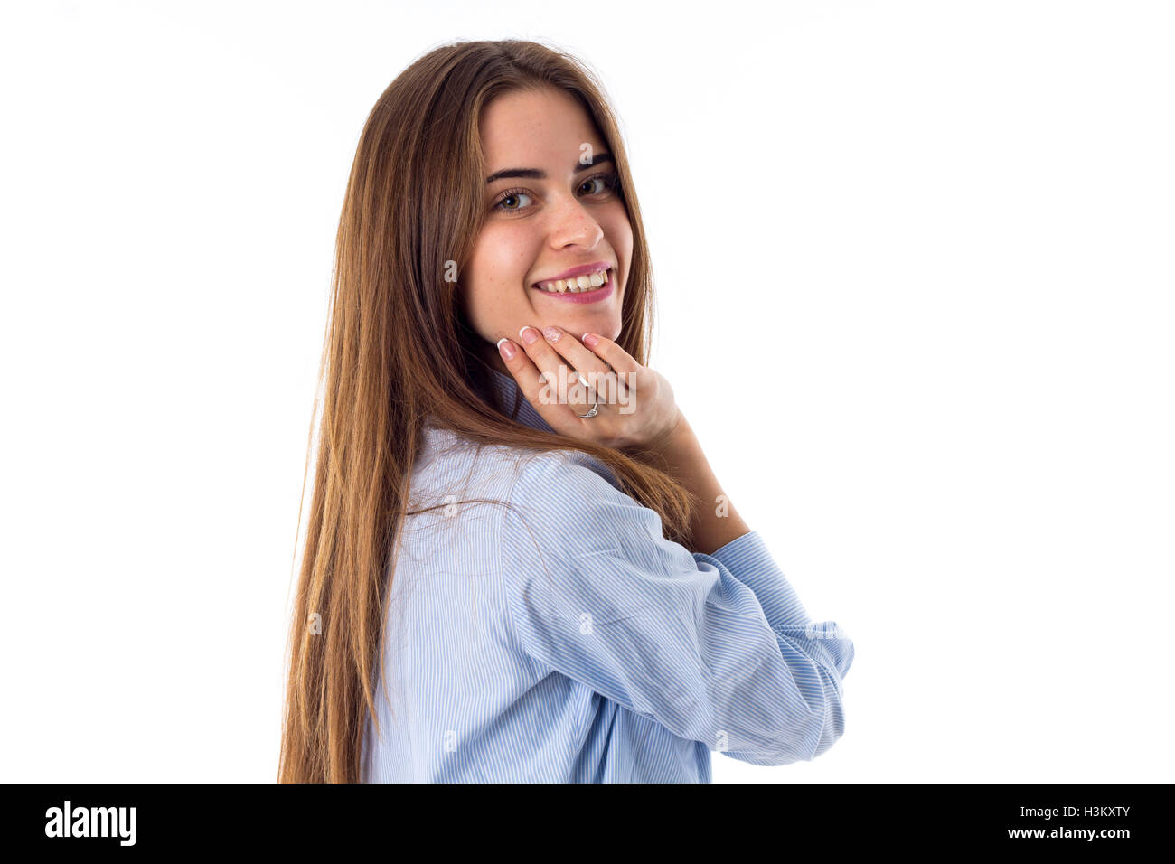 Smiling woman touching face Stock Photo