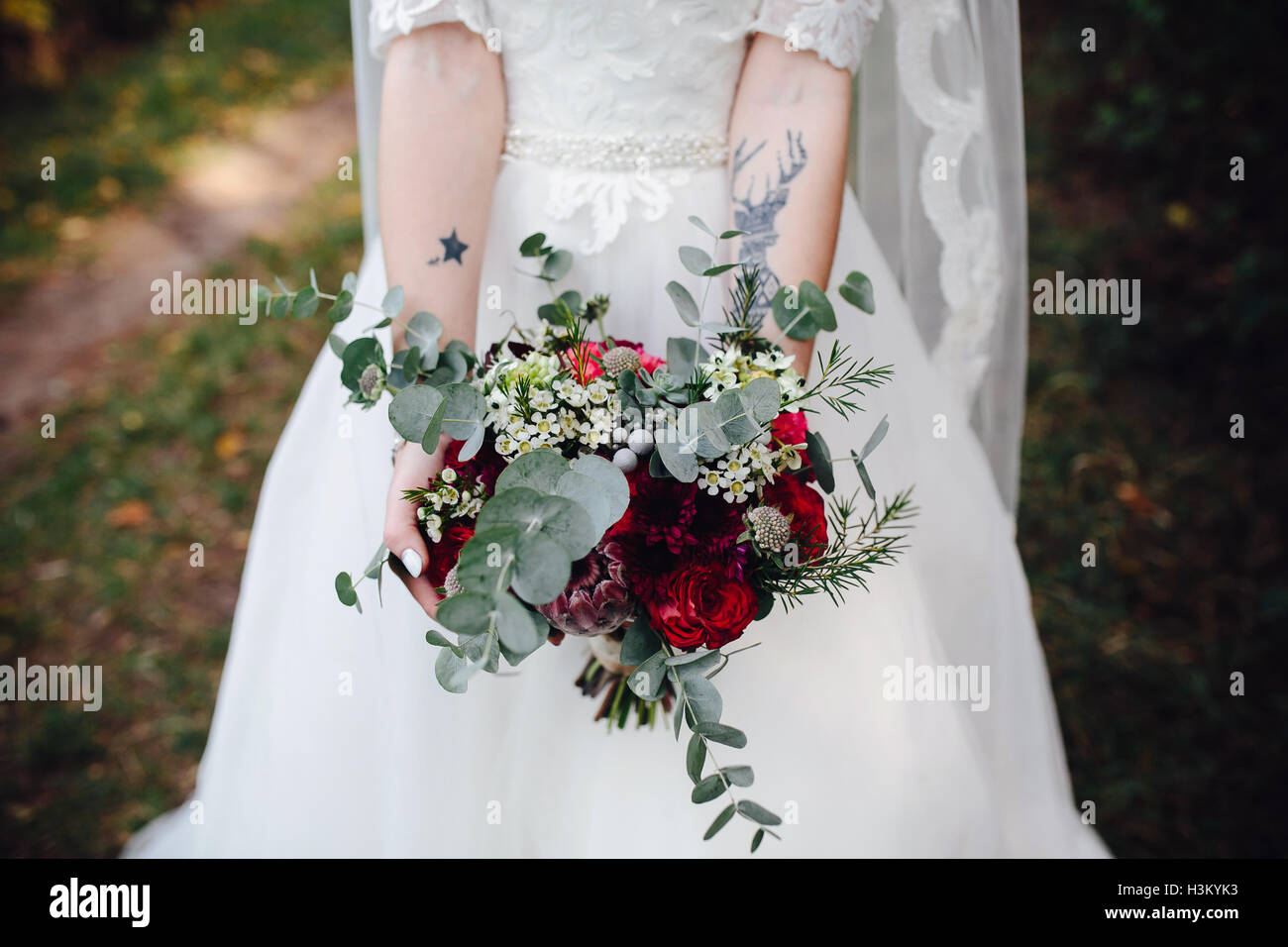 Bride holding wedding bouquet Stock Photo