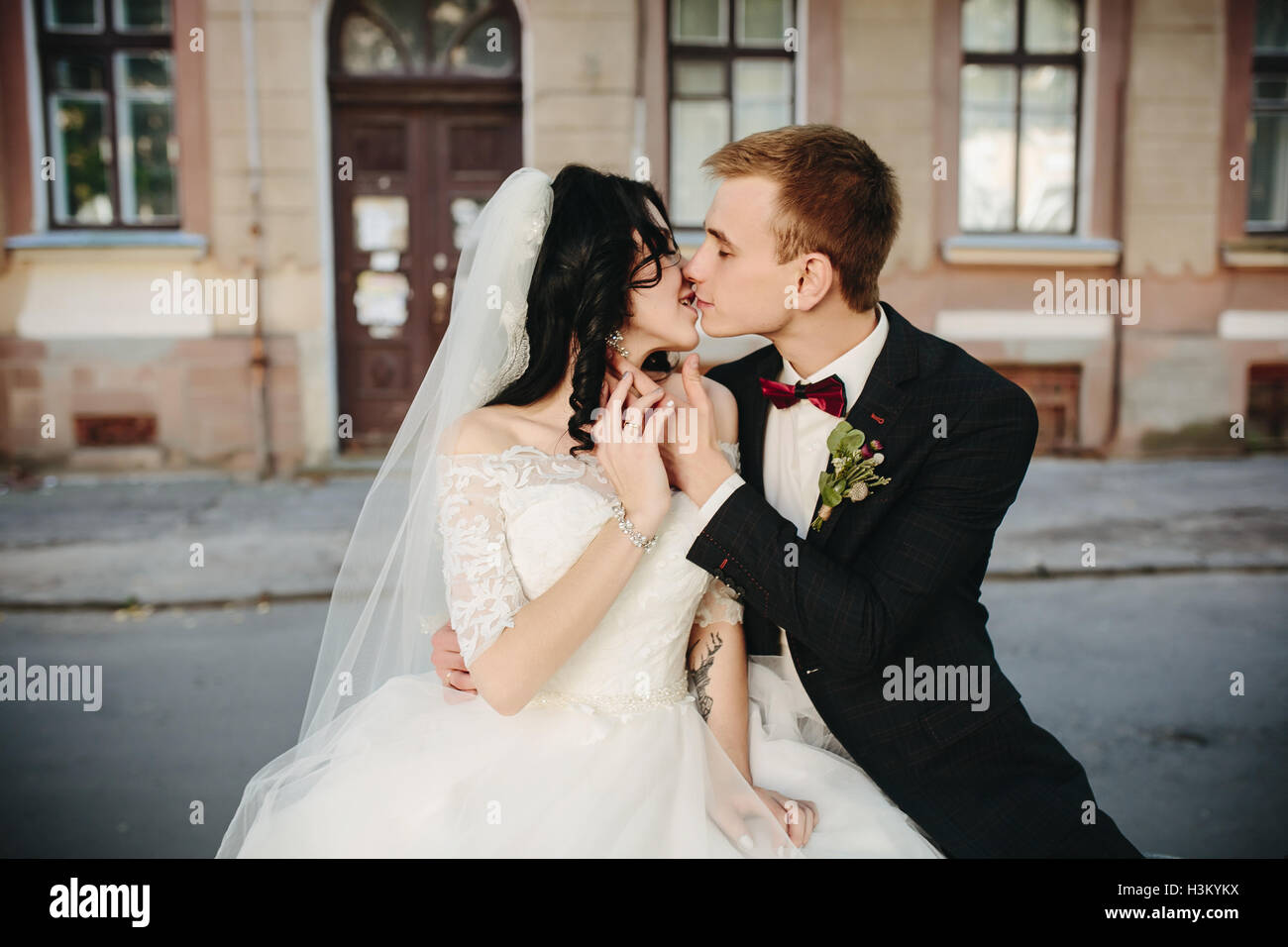 bride and groom posing on the streets Stock Photo - Alamy