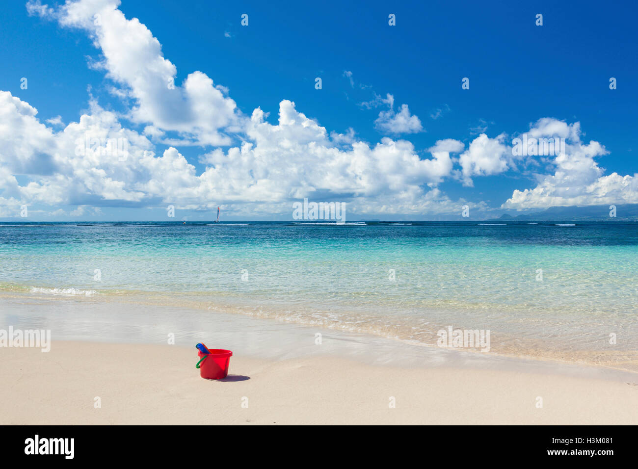 Sand bucket at Caribbean Sea beach Stock Photo