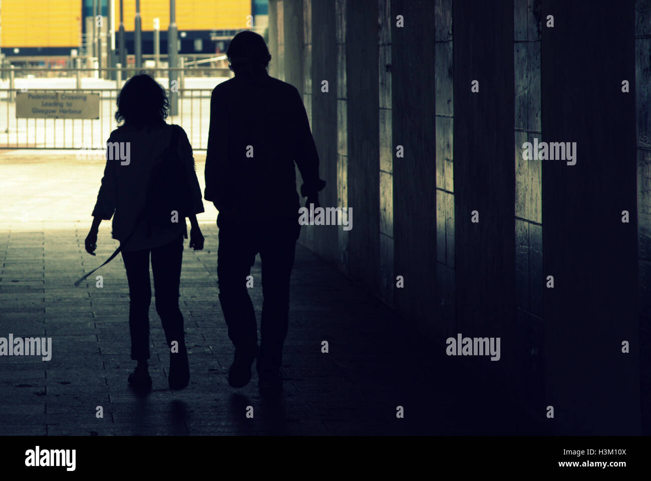 silhouettes of people in the city couple man and women Stock Photo