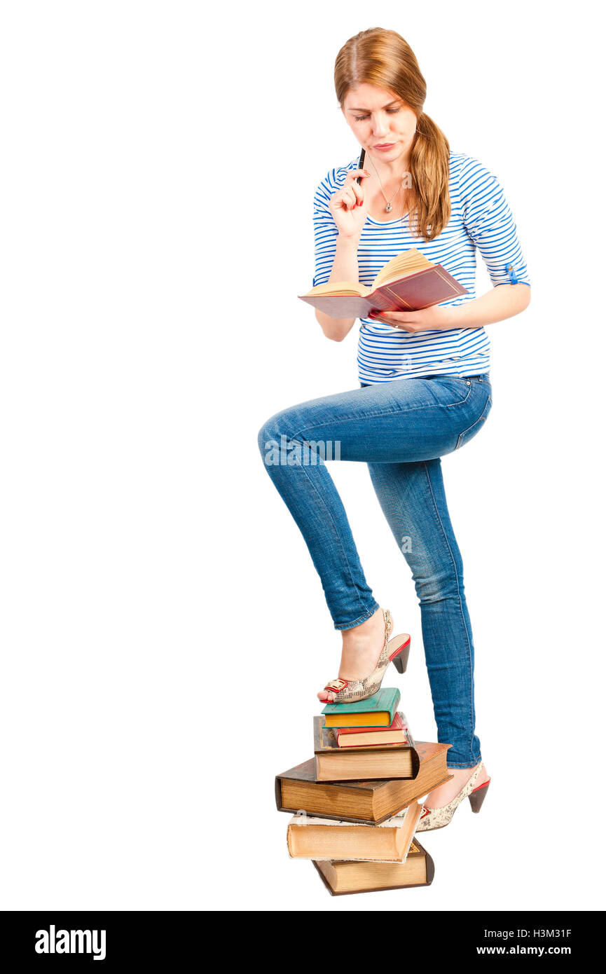 pile of books and a student in the studio Stock Photo - Alamy