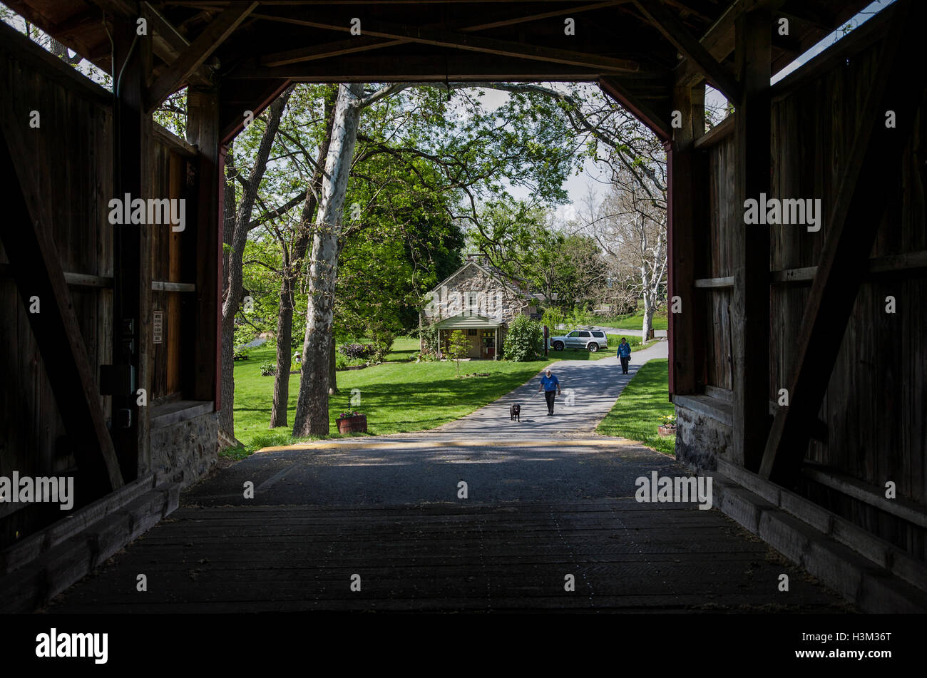 View through a covered bridge in Lancaster County in the Amish country, Lancaster County, Pennsylvania, USA, country abstract  Pa images Stock Photo