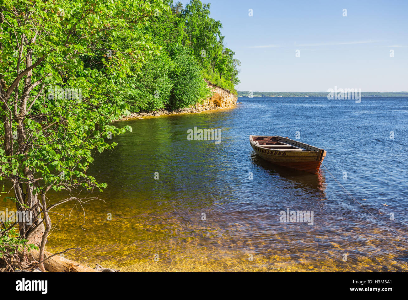 wooden boat on the river bank Stock Photo - Alamy