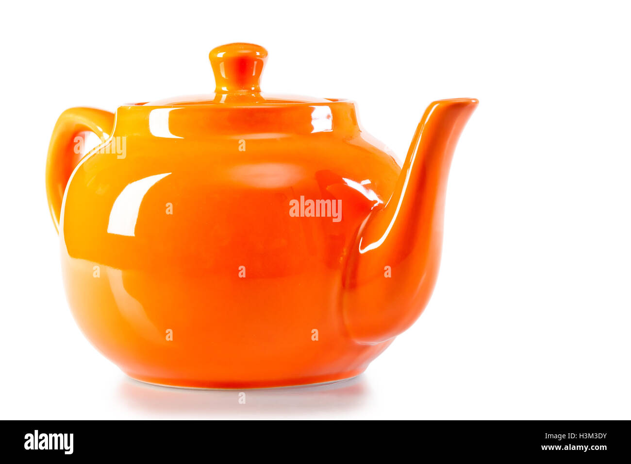 teapot orange on a white background Stock Photo - Alamy