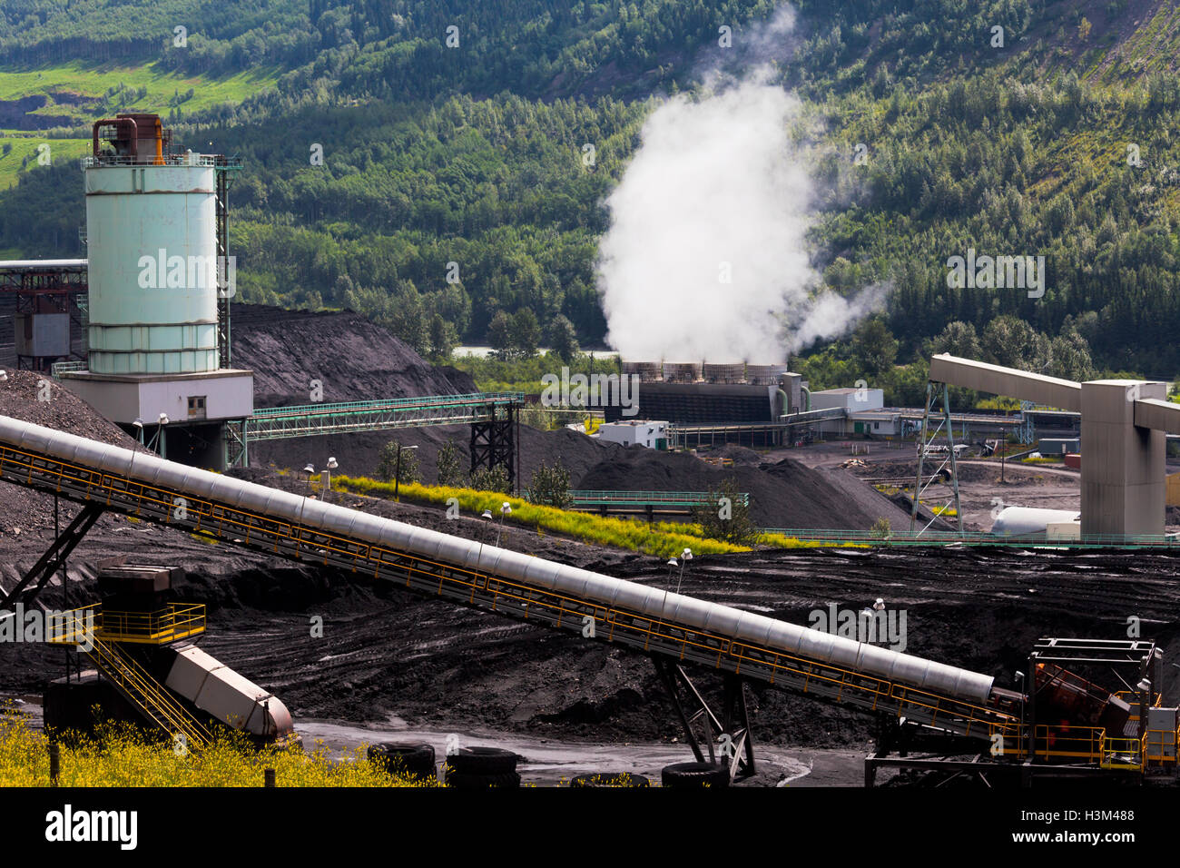 Coal mine electric power plant contrasts nature Stock Photo