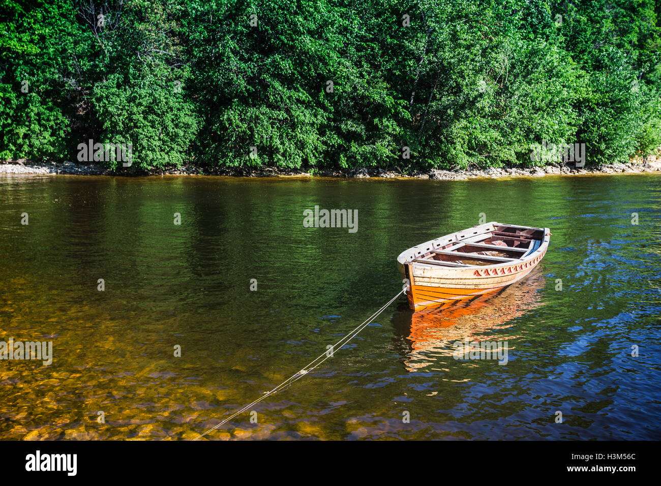 wooden boat on the river bank Stock Photo - Alamy