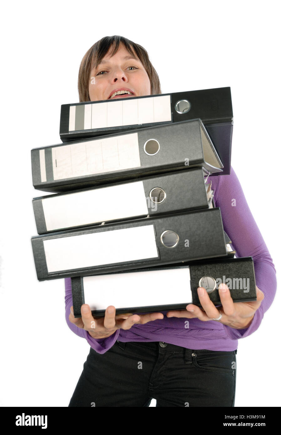 Employee carrying a heavy pile of documents. Stock Photo