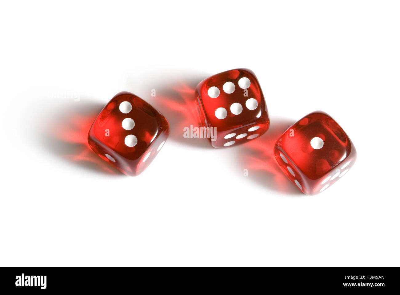 Red glass cubes (three pieces). A white isolated background.   Available in high-resolution and several sizes. Stock Photo