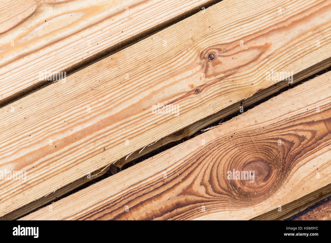 sprayed liquid from the fire on the wooden boards of the roof construction Stock Photo