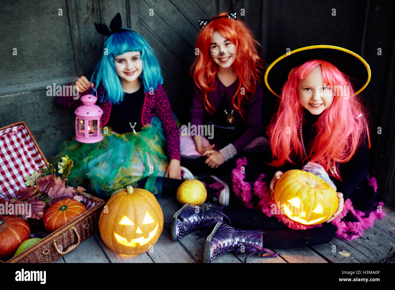 Girls in wigs and traditional Halloween costumes Stock Photo Alamy