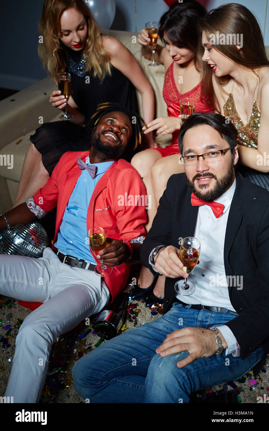 Smart young people with champagne having booze Stock Photo