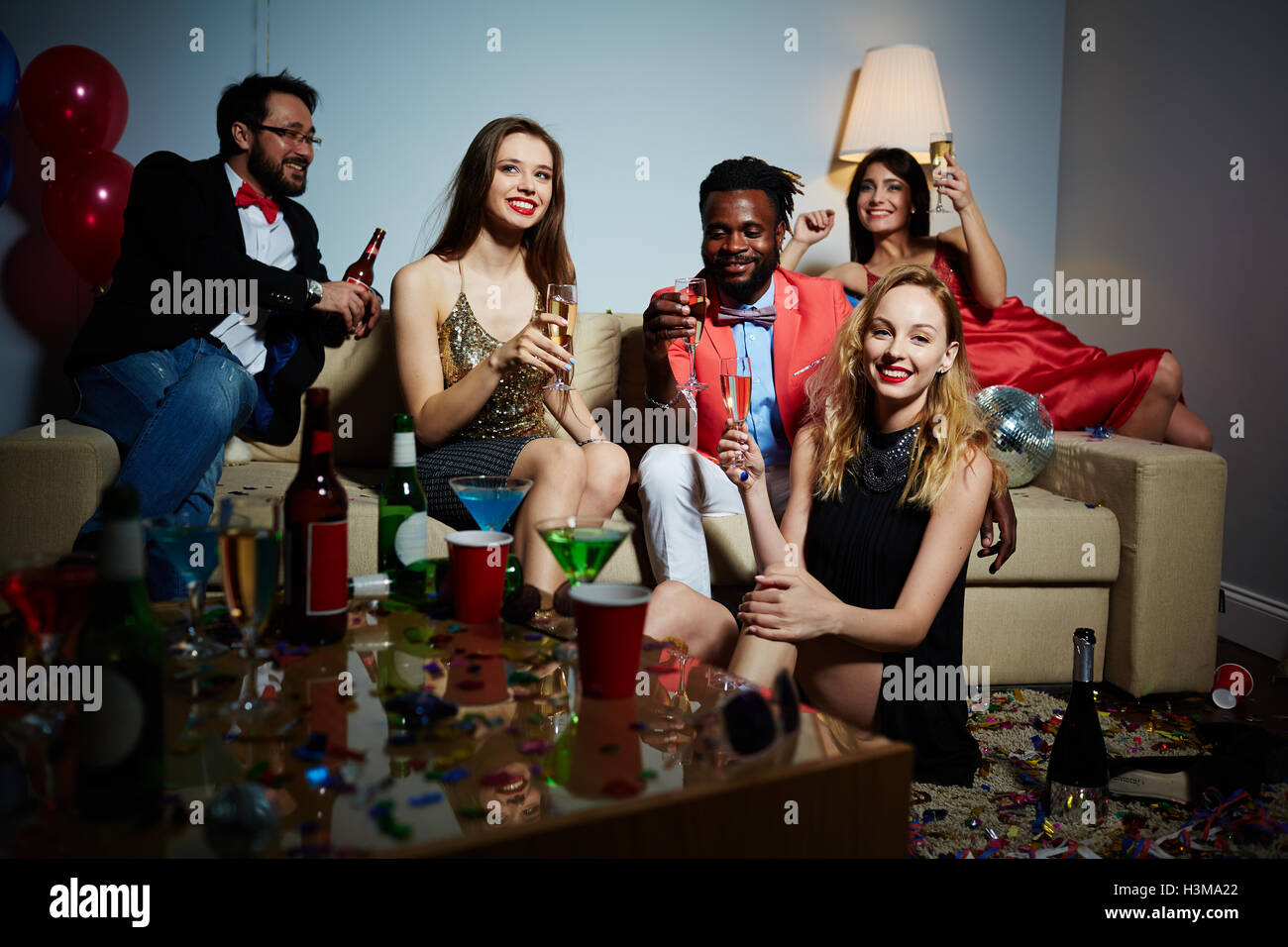 Gathering of friendly young people with champagne Stock Photo