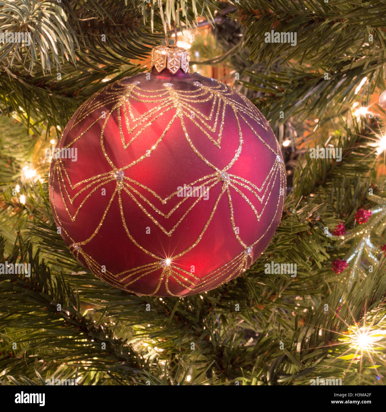 Cone pine, golden bells decorations, red and orange christmas tree ball on  white Stock Photo - Alamy