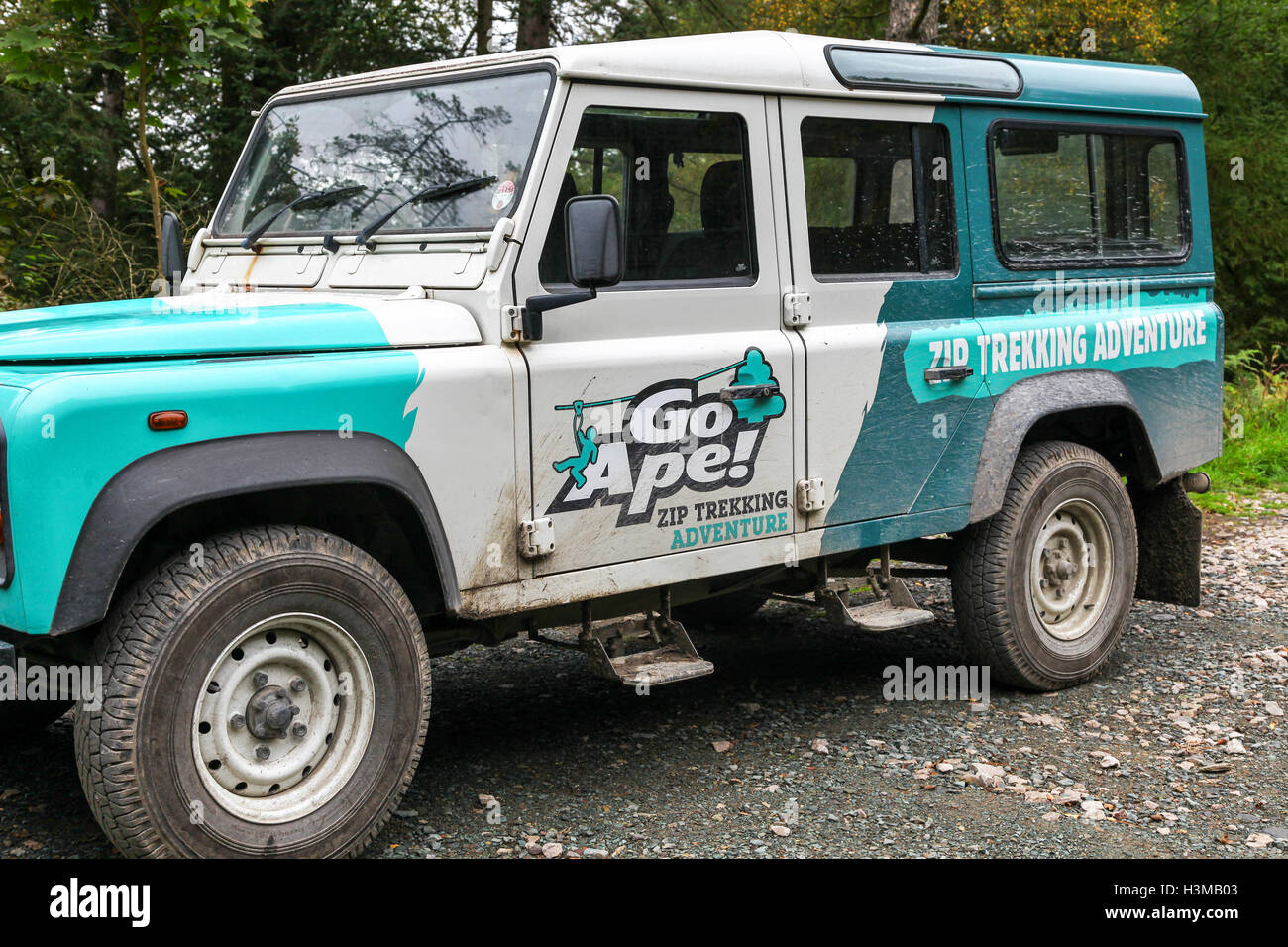 A land rover belonging to Go Ape Zip wire trekking adventure Grizedale Forest English Lake District England UK Stock Photo
