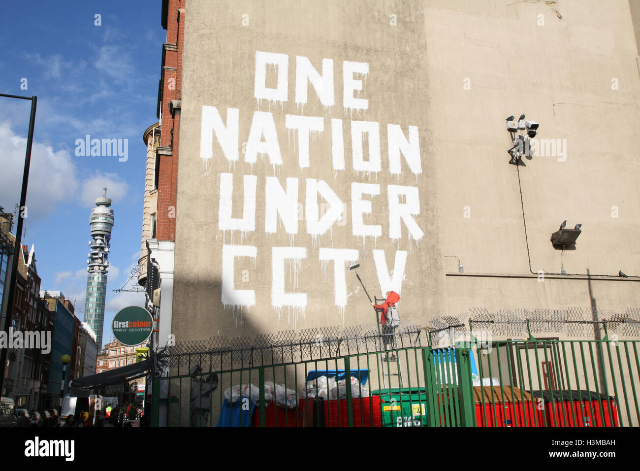 Banksy artwork graffiti One Nation Under CCTV, on wall on Newman Street,London,England,UK,Europe