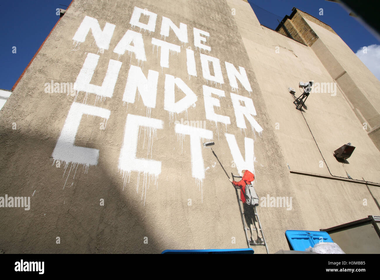 Banksy artwork graffiti One Nation Under CCTV, on wall on Newman Street,London,England,UK,Europe