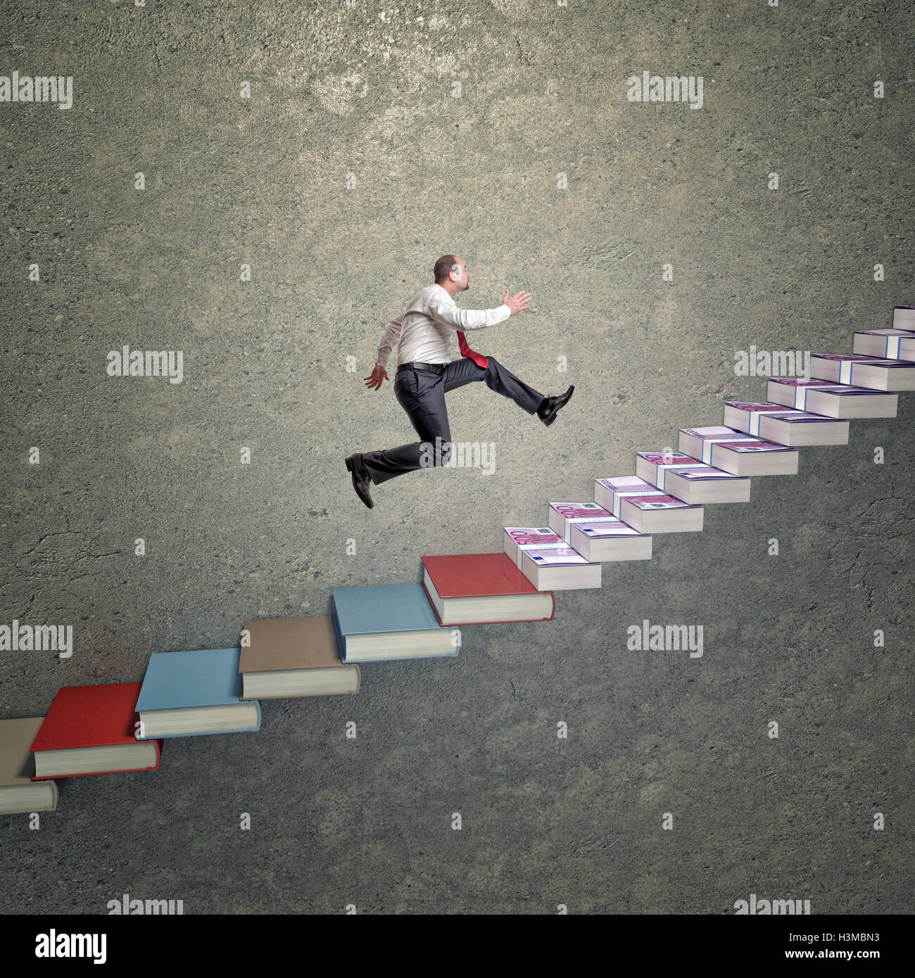 man go up on money and book stair Stock Photo - Alamy