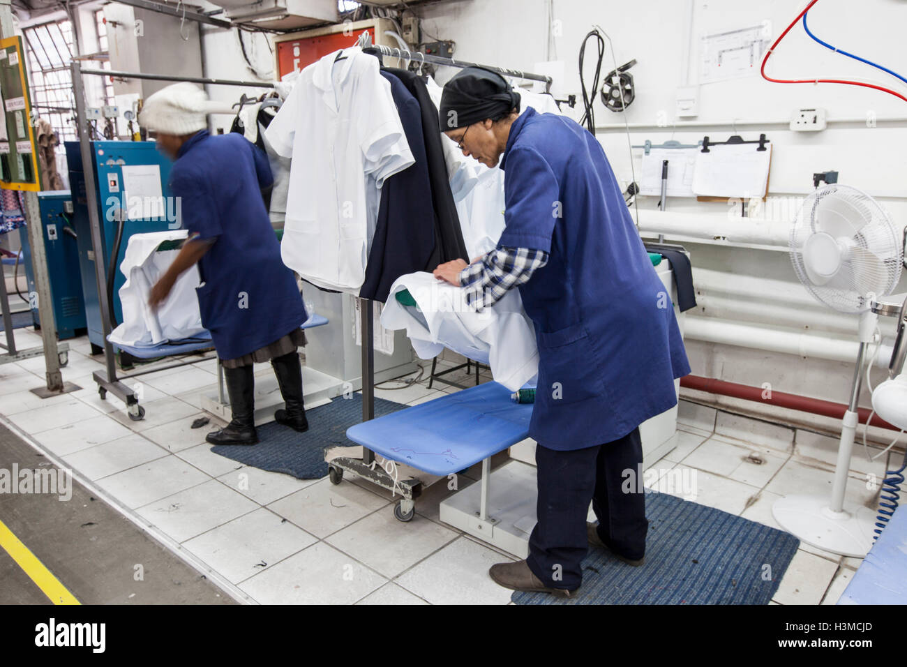 Workers ironing shirt in garment factory Stock Photo Alamy