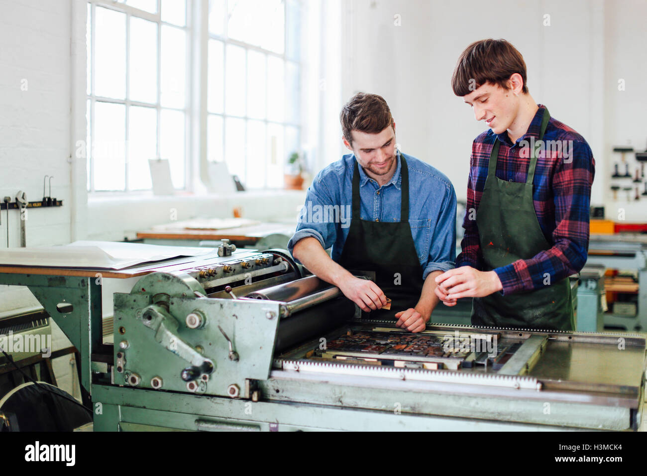 Two Guys Inventing Machine Two men working machine hi-res stock photography and images - Alamy