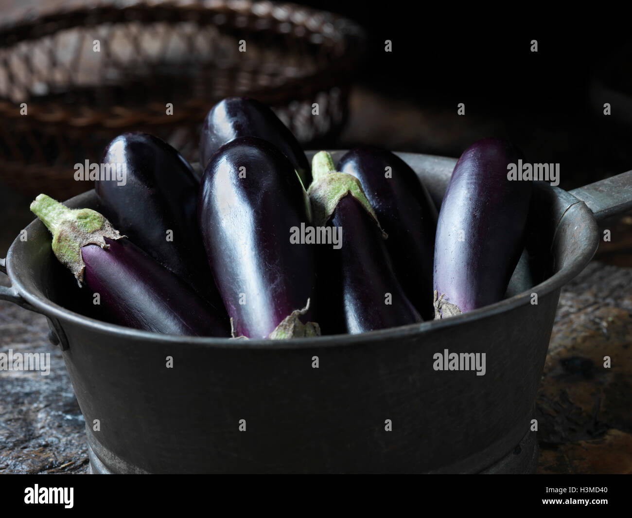 Fresh organic vegetables, oblong baby aubergines Stock Photo