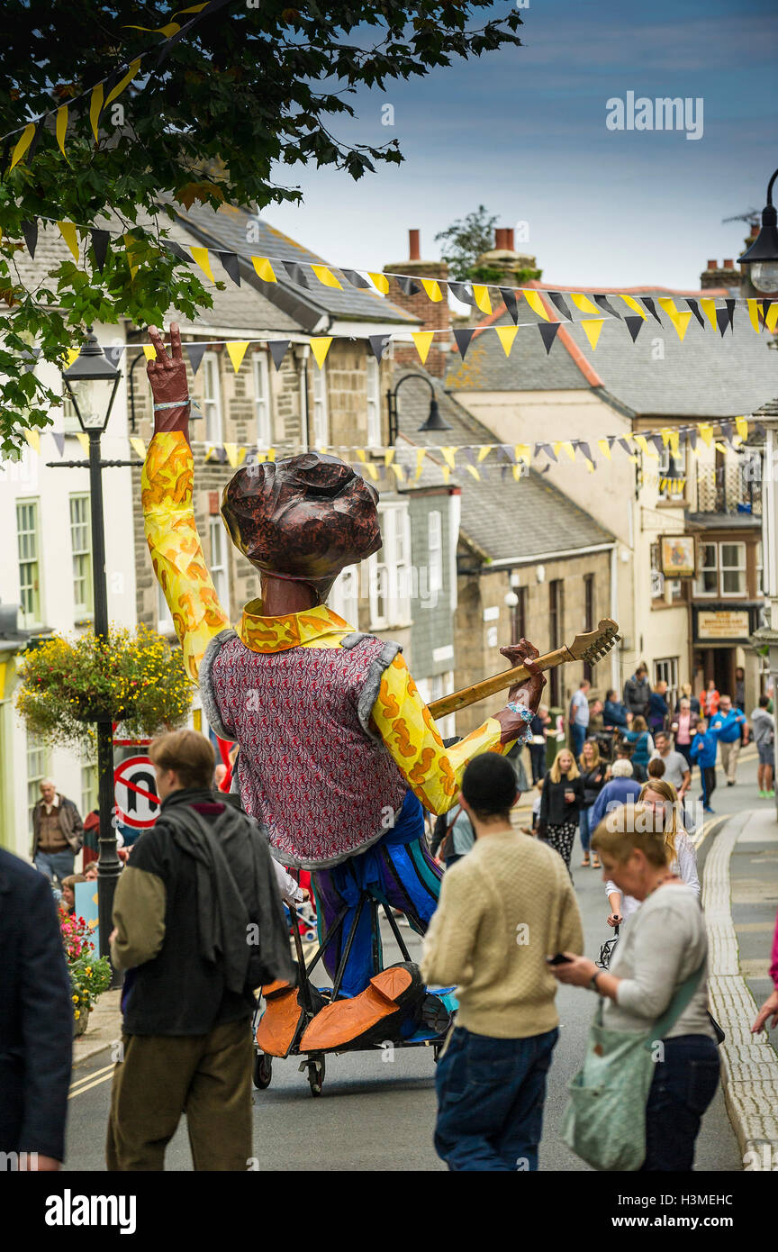 An effigy of a musician is wheeled to the start of the procession in the Penryn Festival in Cornwall Stock Photo