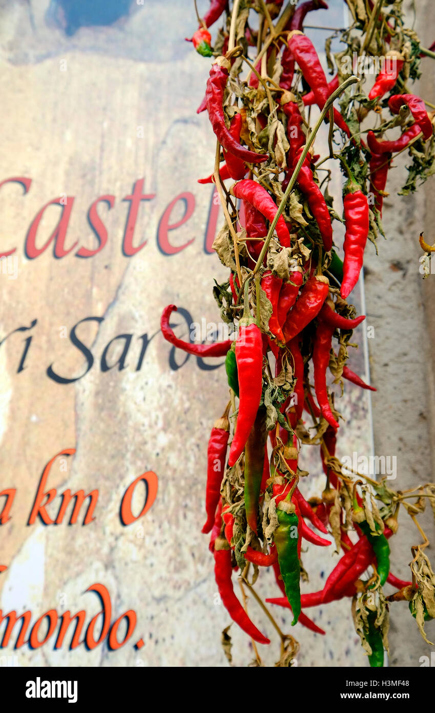 large red hot chilli peppers hanging outside shop, cagliari, sardinia ...