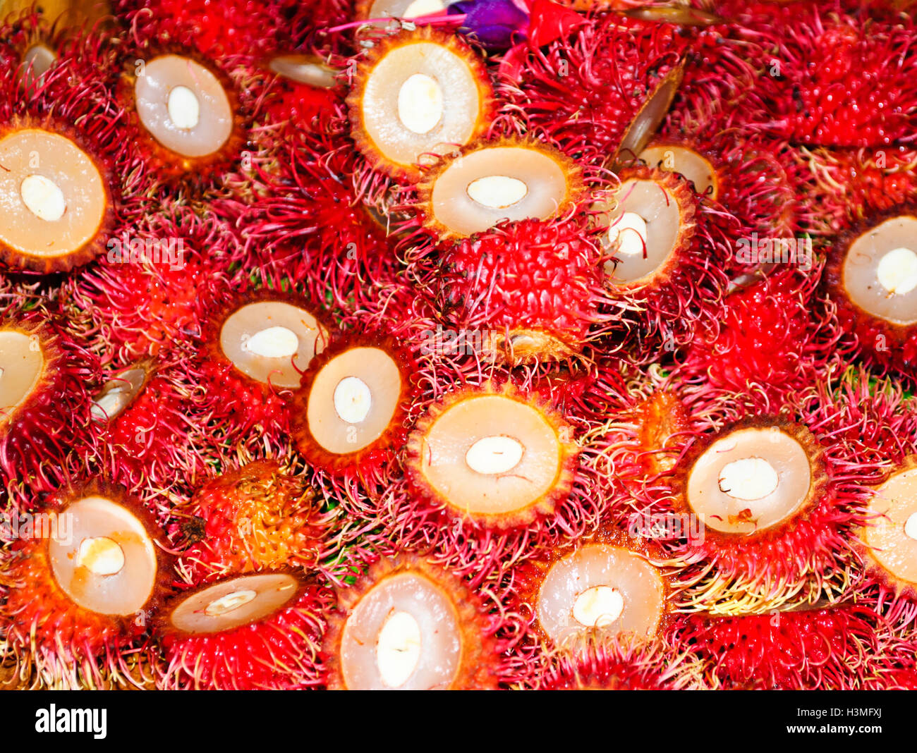 Red hairy fruit hi-res stock photography and images - Alamy