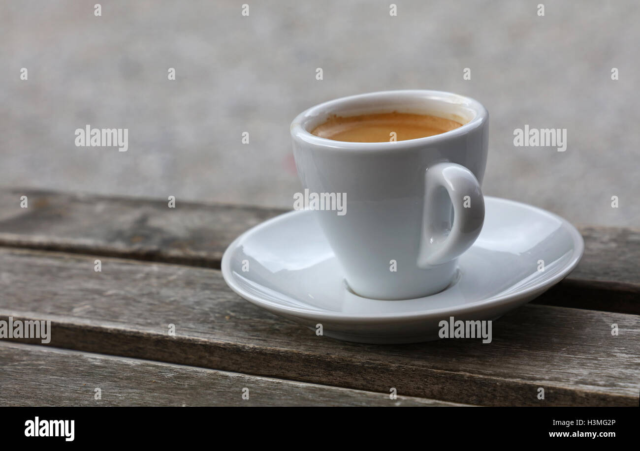 https://c8.alamy.com/comp/H3MG2P/espresso-coffee-shot-brown-crema-froth-in-porcelain-white-cup-with-H3MG2P.jpg