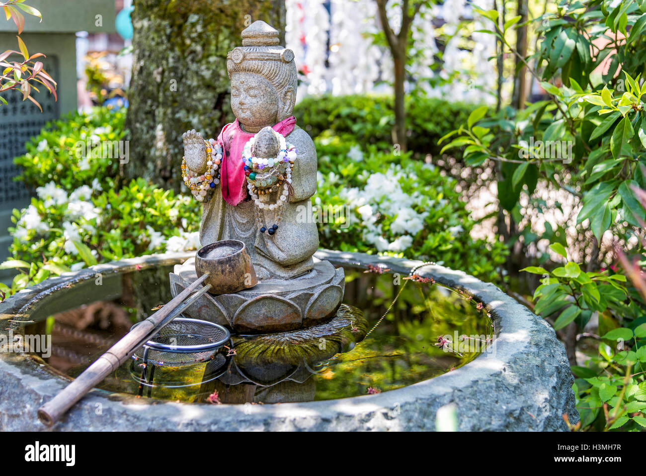 Itsukushima, Japan - April 27, 2014: A purification fountain in Daisho-in temple. Stock Photo