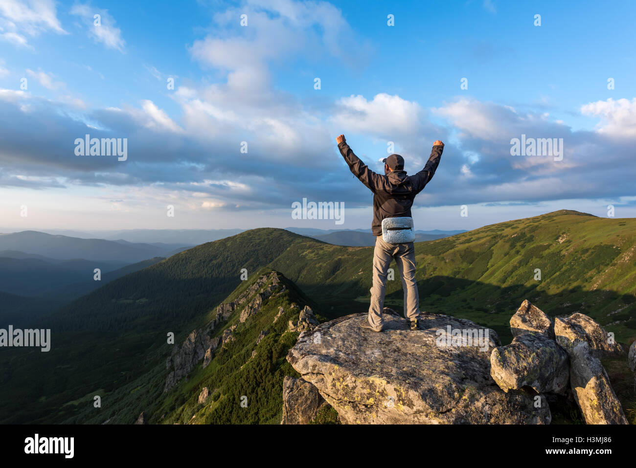 alone tourist on mountain top Stock Photo