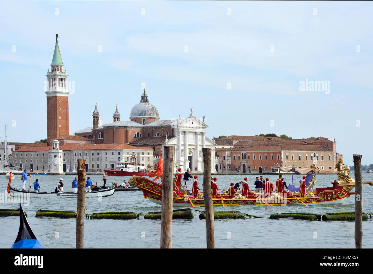 Historical boats parade befor the Island of San Giorgio Maggiore in the Lagoon of Venice in Italy. Stock Photo