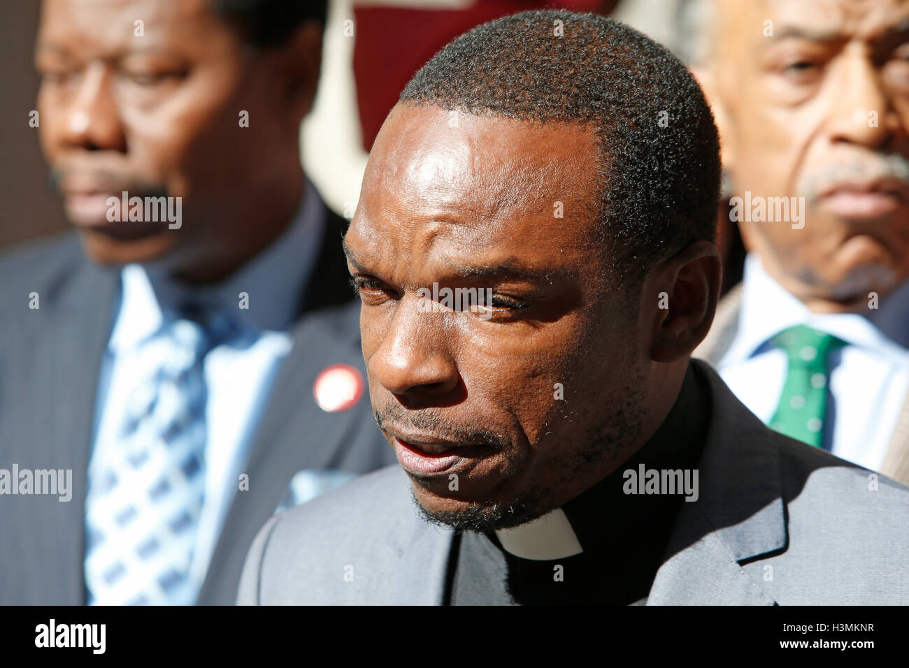 New York City, United States. 10th Oct, 2016. Rev Emmanuel Asse, NAN district manager for Long Island, speaks to the press. Rev Al Sharpton gathered with members of the NYC City Council in Midtown Manhattan to announce support for Haitians displaced by Hurricane Matthew, & to eulogize late Kings County district attorney Ken Thompson who passed away unexpectedly from cancer the day before. Credit:  Andy Katz/Pacific Press/Alamy Live News Stock Photo